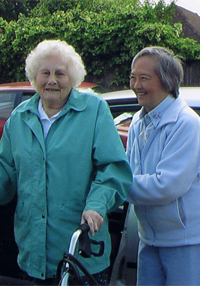 A Care volunteer with a client.